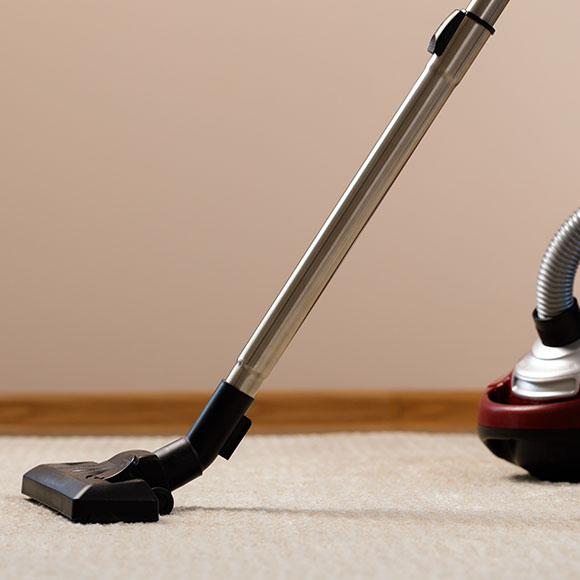 vacuum cleaner nozzle on carpet highlights cleaning efficiency and versatility in home maintenance with three cleaning modes